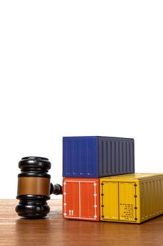 Gavel and shipping containers. Commercial maritime law, international trade regulations, customs disputes, cargo embargoes concept.
