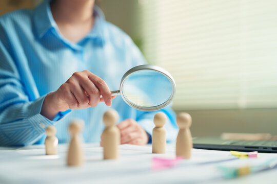 HR professional analyzing potential candidates in a talent pool, human resources management, strategic workforce planning, talent acquisition challenges, and future leadership development