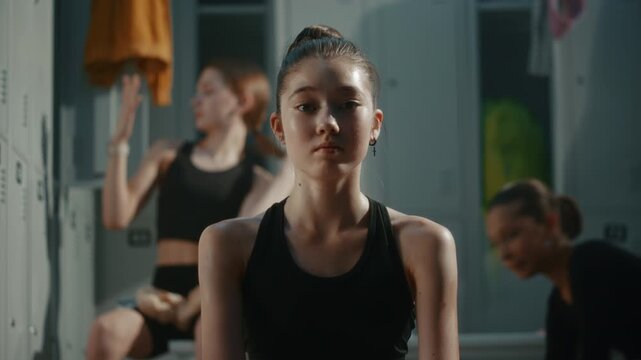 In Dressing Room, Young Gymnasts Performs Stretch While Warming Up Before Competition. Trains Flexibility, Core Stability, Lower Body Mobility, Disciplined Backstage Preparation Routine. Portrait.