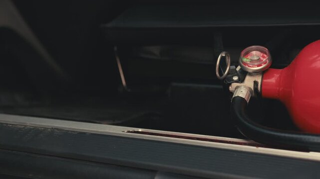 Car fire extinguisher safety equipment inside vehicle