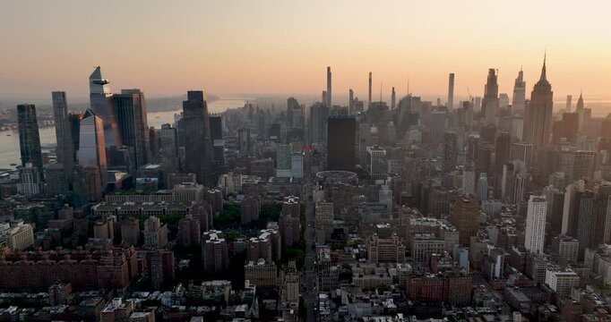 Aerial view of Manhattan tall buildings at sunrise, city skyline panorama of New York City	