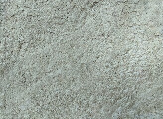 Fototapeta premium Rough grey stone texture background. Detailed closeup of natural rock wall or old concrete surface.