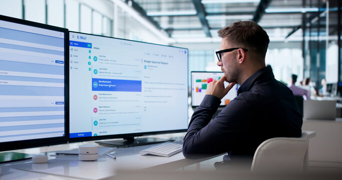 Young Business Manager Sends Client Emails