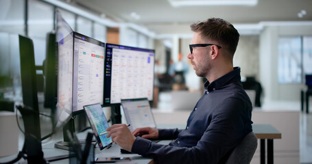 Fototapeta premium Compliance Officer Monitors Live Sanctions Alerts On Laptop