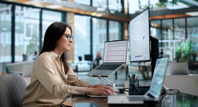 Young Woman Using AI Chatbot Platform On Laptop