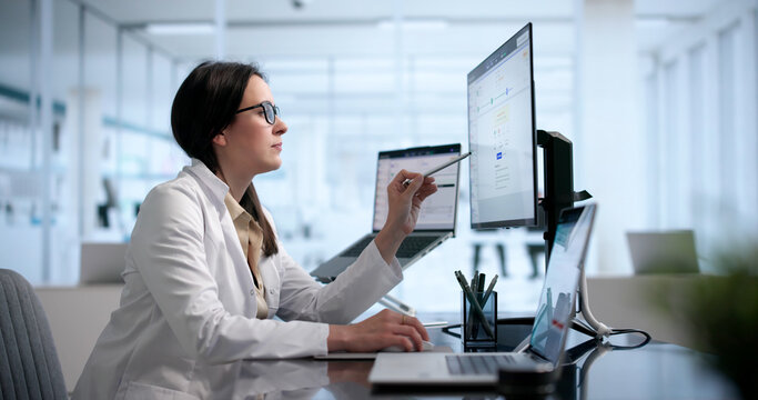 Healthcare Manager Using Laptop