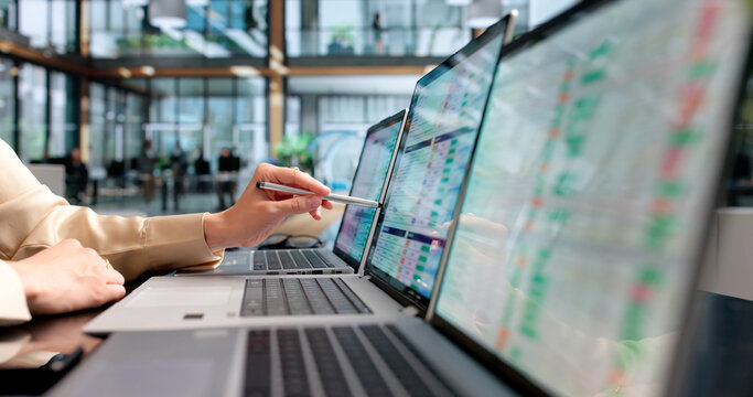 Young Woman Reviews Medical Billing Codes On Laptop