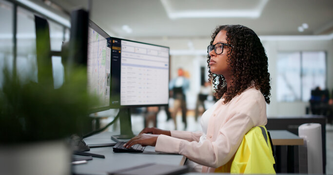 Young African American Woman Uses GIS Software