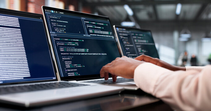 Young African Woman Coding Secure Software On Laptop