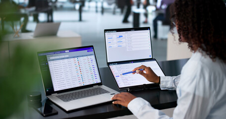Fototapeta na wymiar Young African Woman Reviews Compliance Data