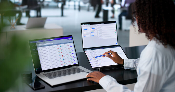 Young African Woman Reviews Compliance Data