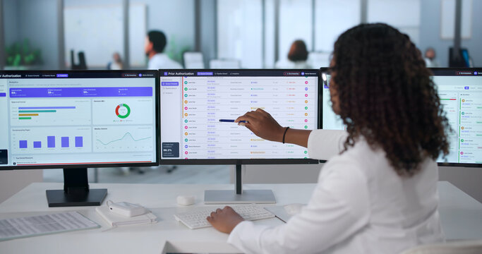 Young African American Healthcare Manager Reviews Medical Authorization