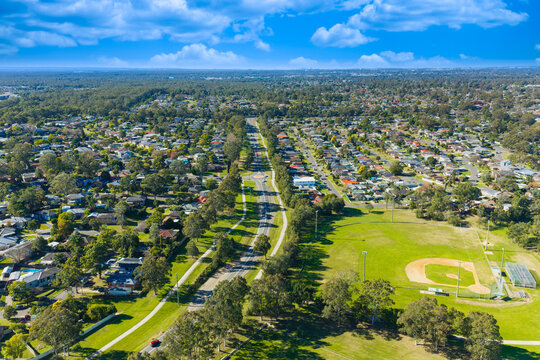 Drone aerial photograph of modern high density housing and the surrounding neighbourhood infrastructure and utilities in the Greater Western Sydney town of Penrith in New South Wales, Australia