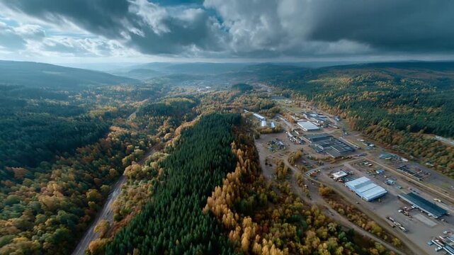 Industrial Landscape: An expansive aerial view showcases a sprawling industrial complex nestled within a dense, autumnal forest, under a dramatic, cloud-laden sky.