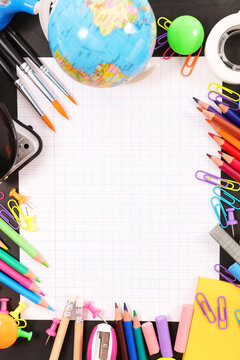 Back to school background with blank notebook paper and supplies