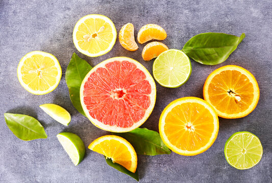 Flat lay of fresh citrus fruits assortment with grapefruit orange and lemon