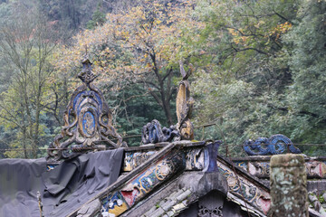 Ancient Chinese rooftop with unique traditional ornamental motifs at Mount Qingcheng in Dujiangyan, Chengdu, Sichuan Province of China © Crystaltmc