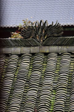 Ancient Chinese rooftop with unique ornamental motifs at Mount Qingcheng in Dujiangyan, Chengdu, Sichuan Province of China
