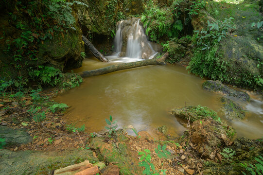 Serene Namtok Waterfall Behind Gorge in Lush Green Environment