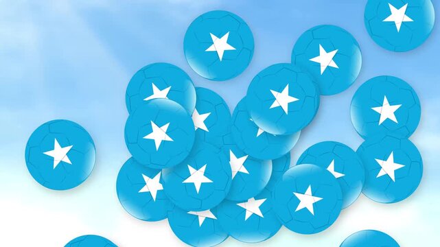 Blue Star Patterned Soccer Balls Falling Through a Cloudy Sky