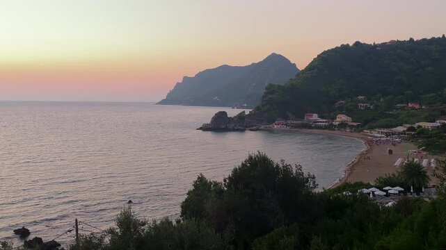 Static sunset view of Pelekas Beach, Corfu, Greece overlooking the Ionian Sea