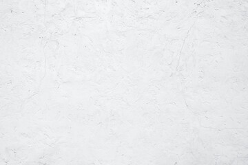 Fototapeta premium Empty white building wall texture background. Rough surface and cracked white cement wall. White wall texture abstract background. Concrete surface. Exterior concrete building wall. Plaster work.