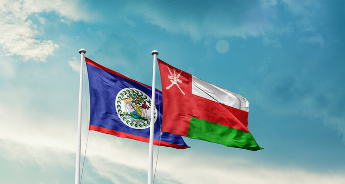 Belize and Oman friendship flags are waving in the sky. Two country flag for agreement or deal. Belize Oman national flag for commitment.
