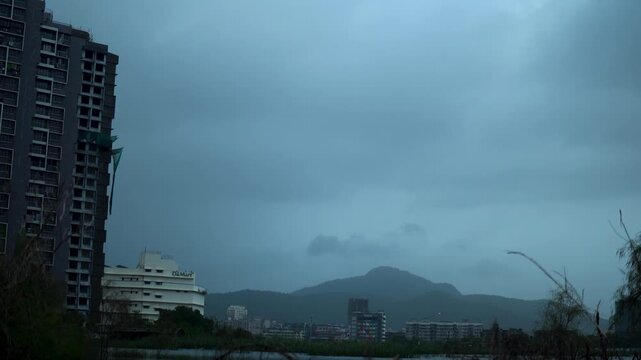 Dark Rain Clouds Covering Scenic Mountain Range During Monsoon Season. Beautiful monsoon clouds moving above lush green mountains in western India. Natural rainy season landscape ideal for weather, tr