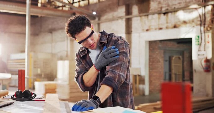 Carpentry, shoulder pain or man in workshop with massage, muscle issue or fatigue in building project. Accident, overworked or carpenter with discomfort, arm strain or labor injury in woodworking.