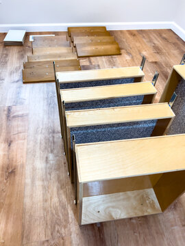 Wood stair treads arranged on interior flooring