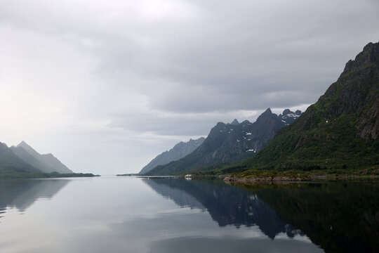 Mountains reflected in the water of the Trollfjord, Norway