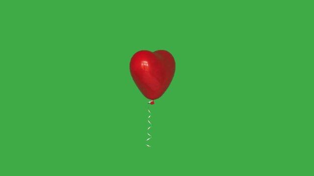 Red round balloon transforming into heart shape on green screen