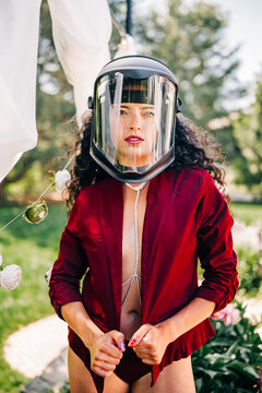 Woman wearing glamorous clothes and a face shield