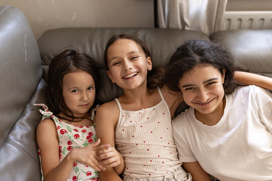 enjoying authentic sibling moments and modern family life.