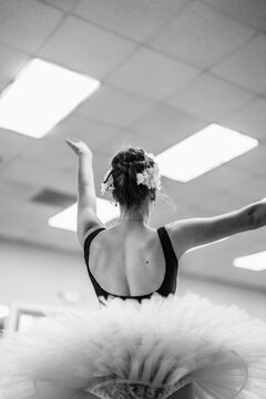 Ballerina dancing ballet wearing tutu in studio
