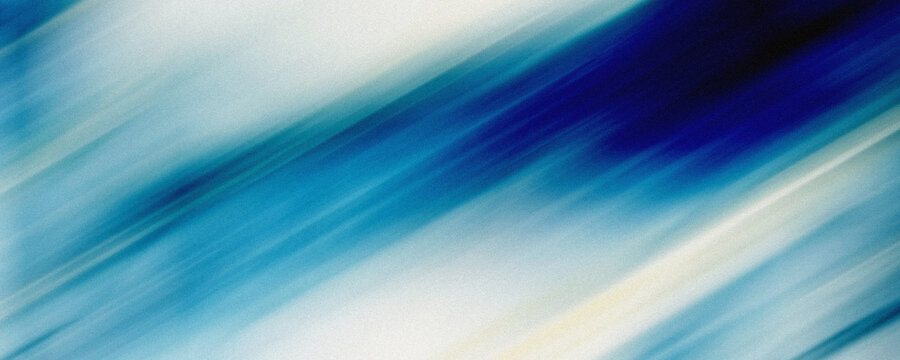 Abstract blue motion blur background with grainy texture.