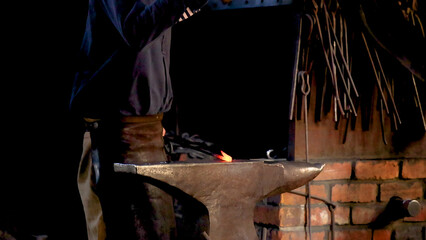 Blacksmith Forging Glowing Metal on an Anvil in Ballarat Workshop © blueringmedia