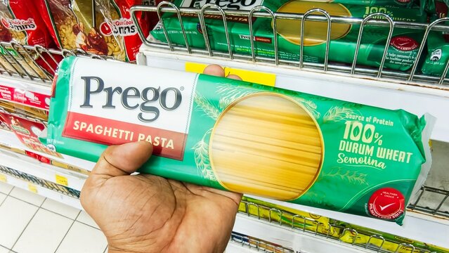 Malaysia Kuala Terengganu 18 July 2026: Hand holding the product Package of Prego Spaghetti pasta in supermarket.