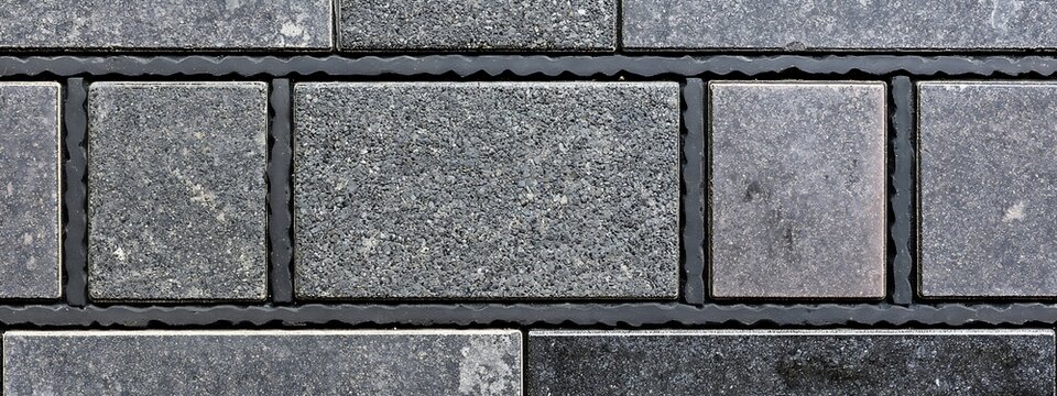 Natural grey stone tile texture, seamless granite paving blocks background, architectural limestone floor pattern for exterior design
