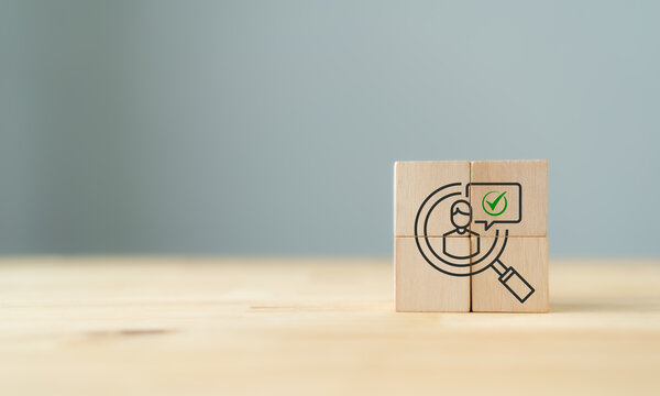 Target Customer and recruitment concept. Wooden blocks showing a magnifying glass, customer icon, and approval check. Target audience identification, recruitment, customer selection and qualification.