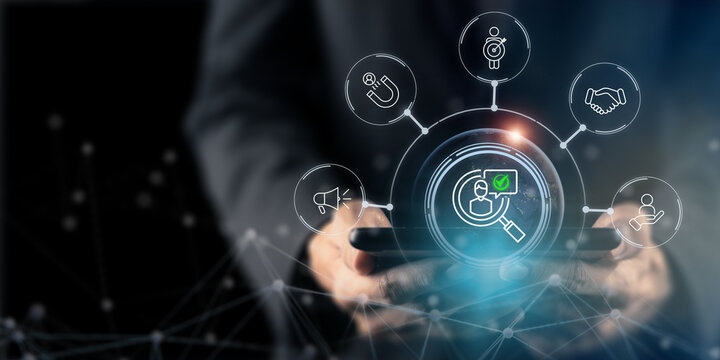 Target customer journey and digital marketing strategy concept. Using a tablet with digital icons for customer targeting, lead generation, engagement, customer loyalty. Data-driven marketing strategy.