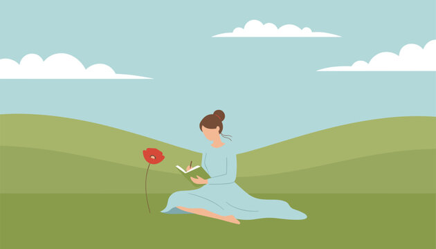 Woman sitting in a green grassy meadow under a cloudy sky writing down thoughts in her journal near a flower.