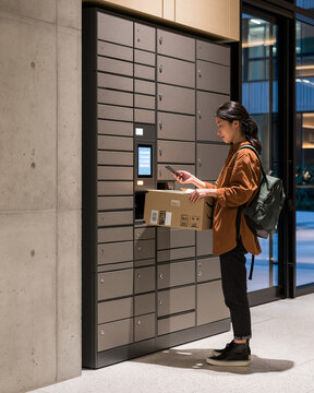 Resident collecting a parcel from an apartment locker
