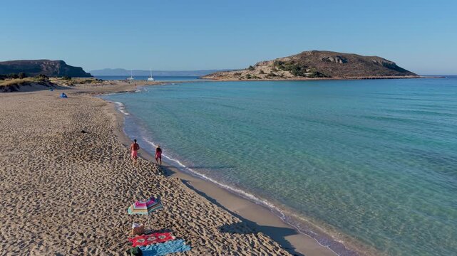 Feel the warmth of the sun while exploring Simos Beach in Elafonisos, Greece. Crystal-clear waters wash gently on soft sands, creating a perfect backdrop for relaxation and fun. Experience paradise.