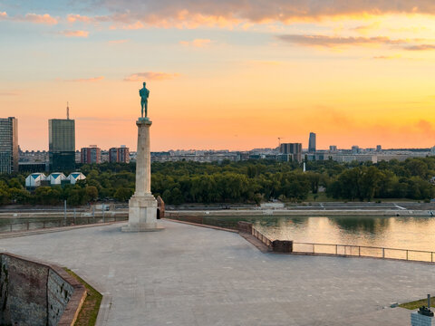 Pobednik Victor Monument overlooking Belgrade river landscape at sunset