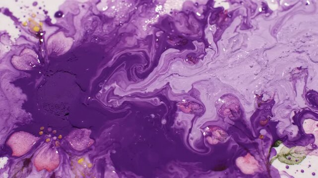 Artistic motion of purple watercolor paint splashes blending with delicate hand painted floral patterns on a wet paper texture