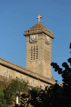 NHA TRANG, VIETNAM: The majestic neogothic clock tower and bell tower of Christ the King Cathedral rising into the sky.