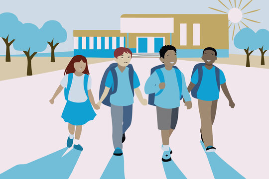 Group of children walking home from school together on a sunny day in a suburban area