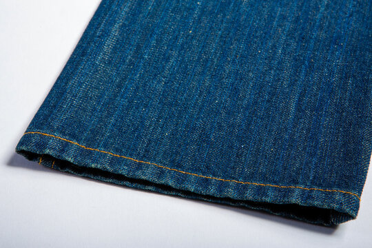 Detailed image of jeans on a white background