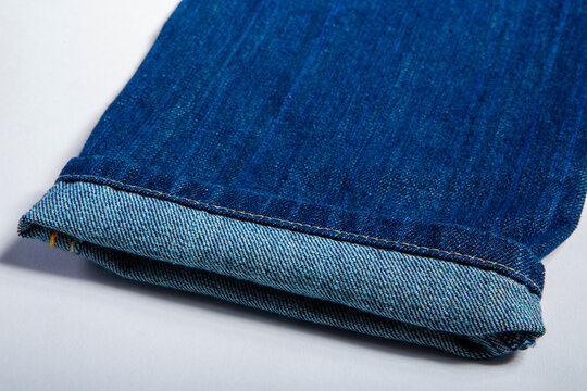 Detailed image of jeans on a white background